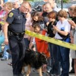 Police dog and crowd